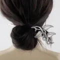 Detail of vintage Celtic silver leaf hair pin stick used in a bun hairstyle for women - D-982 Style (D-982) / Antique Silver