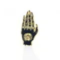 Macro view of black and gold monster claw enamel brooch with DOOM metal engraving - Doom Monster Claw Style (D-665)