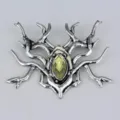 Close-up detail of silver Gothic spider brooch featuring a marquise-cut yellow central gem - Dark Spider Style (D-117)