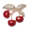 Elegant triple cherry fruit brooch featuring vibrant red enamel and sparkling rhinestone leaves - Three Cherry Pave Rhinestone Leaf Style (D-1760)