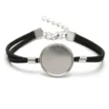 Close-up view of a 20mm DIY bracelet base with black velvet cord and silver alloy tray - White K - Black