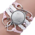 Close-up of handmade multi-layer braided bracelet base with heart and love charms - Pink White