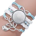 Detailed view of handmade multi-layer braided bracelet base with infinity and bird charm - White Blue