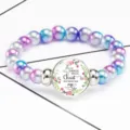 Detailed macro view of Philippians 4:13 Bible verse on colorful beaded stretch bracelet - 12032501
