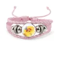Pink braided leather bracelet with sunflower and butterfly cabochon charm detail - 18mm / Pink