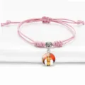 Adjustable pink braided rope bracelet featuring a religious Mazu deity charm pendant - Pink (A9105802)