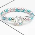 Detail view of colorful beaded bracelet featuring an inspirational quote gem - 12032505