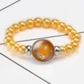 Middle East theme elastic pearl bracelet with orange crescent moon star glass gem - Gold