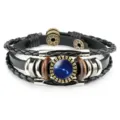 Detailed macro of the blue constellation cabochon on a layered leather bracelet - Aries