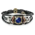 Detailed view of vintage multilayer leather bracelet with blue Taurus constellation glass gem - Taurus