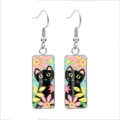 Macro view of cute black cat and colorful floral patterns on glass cabochon earrings hook - 10x25mm / Black Cat Floral