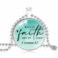 Detail view of a silver bead chain necklace with 'Walk by Faith' Bible verse glass pendant - 25mm / Cyan