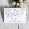 Elegant white laser-cut wedding invitation card featuring love birds and heart motifs - White