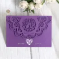 Elegant purple laser-cut wedding invitation card with love birds and heart lace design. - Deep purple