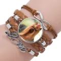 Close-up detail of a multi-layer braided leather bracelet with a dog photo and Love charm - 12008719 (Yorkshire Terrier-Dark Brown)