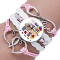 Macro detail showing Autism Awareness central charm on a pink and white braided bracelet - 12038603