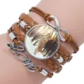 Detailed view of a multi-layer braided leather bracelet with a dog photo charm. - 12008706 (Golden Retriever-Brown Leather)