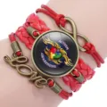 Detail view of handmade red multi-layer woven bracelet with Autism Awareness design - 12038606