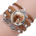 Close-up of a multilayer braided leather bracelet with a golden retriever photo charm - 12008704 (Golden Retriever-Brown)