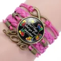 Detailed view of pink multi-layer autism awareness bracelet with puzzle piece charm - 12038609