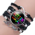 Close-up of autism awareness bracelet with Love charm and embrace the amazing message - 12038612