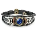 Close-up of retro Libra constellation leather bracelet with glass cabochon detail - Libra