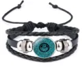 Handcrafted cowhide leather bracelet featuring a cyan Arabic calligraphy glass charm - 18mm / Cyan Blue