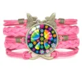 Pink multi-layer braided peace sign bracelet with butterfly charms and infinity symbol - Hot Pink