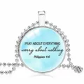 Inspirational quote pendant necklace featuring silver ball chain and light blue background - 25mm / Light Blue