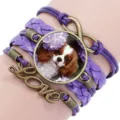 Purple woven multi-layer bracelet featuring a Cavalier King Charles Spaniel glass cabochon - 12008711 (Cavalier King Charles Spaniel-Purple)