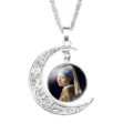 Close-up detail of Girl with a Pearl Earring glass cabochon in moon pendant necklace - Girl with a Pearl Earring