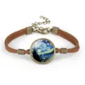 Detailed view of Van Gogh's Starry Night painting in a glass dome on a suede rope bracelet. - Starry Night (#04)
