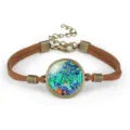 Detail of Van Gogh Irises painting glass cabochon bracelet with brown suede cord - Irises II (#08)