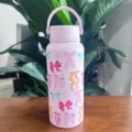 Pink vacuum insulated stainless steel water bottle featuring a vibrant colorful bow pattern - Bowknot Print (Graph 6)