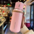 Portable pink 316 stainless steel insulated water bottle with cup lid and handle strap - 600ml / Pink