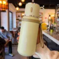 Large capacity pale green 316 stainless steel insulated thermos with handle lid and strap. - 600ml / Green