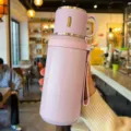 Portable purple 316 stainless steel vacuum insulated water bottle with a cup lid - Purple