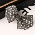 Modische Strass Kristall Schleife Haarspange, elegante Haarspange glänzendes Accessoire für Damen. - Schmetterling Dreieckglas Grau und Transparent