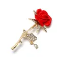 Close-up detail of the red rose brooch, shining rhinestones, gold-plated stem and leaf design. - D-1302 Blooming Red