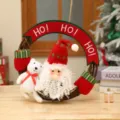 Christmas wreath hanging decoration with cute plush Santa Claus and white bear figures. - Santa Claus Style