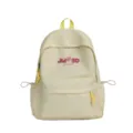 Vista detallada de la elegante mochila escolar amarilla con logotipo de trébol bordado. - Sin Colgante / Amarillo