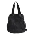 Detail view of black washed denim multifunctional backpack, highlighting durable texture. - Black