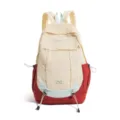 Detail view of casual nylon backpack with multi-pocket drawstring design and contrast color blocking. - Red
