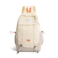 Detail view of the stylish casual backpack featuring contrast color and front bungee cord. - Light Gray