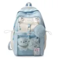 Sac à dos d'étudiant mignon de couleur contrastée avec poche en maille et jolie peluche. - Bleu
