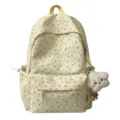 Detailansicht des Blumen-Rucksacks aus Stoff mit Plüsch-Anhänger, praktische Seitentaschen. - Groß (Ohne Anhänger) / Gelb