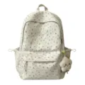 Detailansicht des niedlichen Blumen-Schulrucksacks aus Leinen mit flauschigem Stern-Anhänger. - Groß (Ohne Anhänger) / Weiß