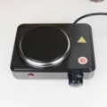 Electric hot plate detail view showing heating burner control knob and power indicator light. - 800W EU Plug / Black