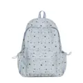 Detailed view of the cute star print and front pocket on the light blue rucksack. - Blue