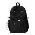 Detailed view of the black canvas school backpack with front drawstring and cute plush pendant. - Without Pendant / Black